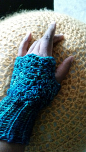 hand in fingerless glove